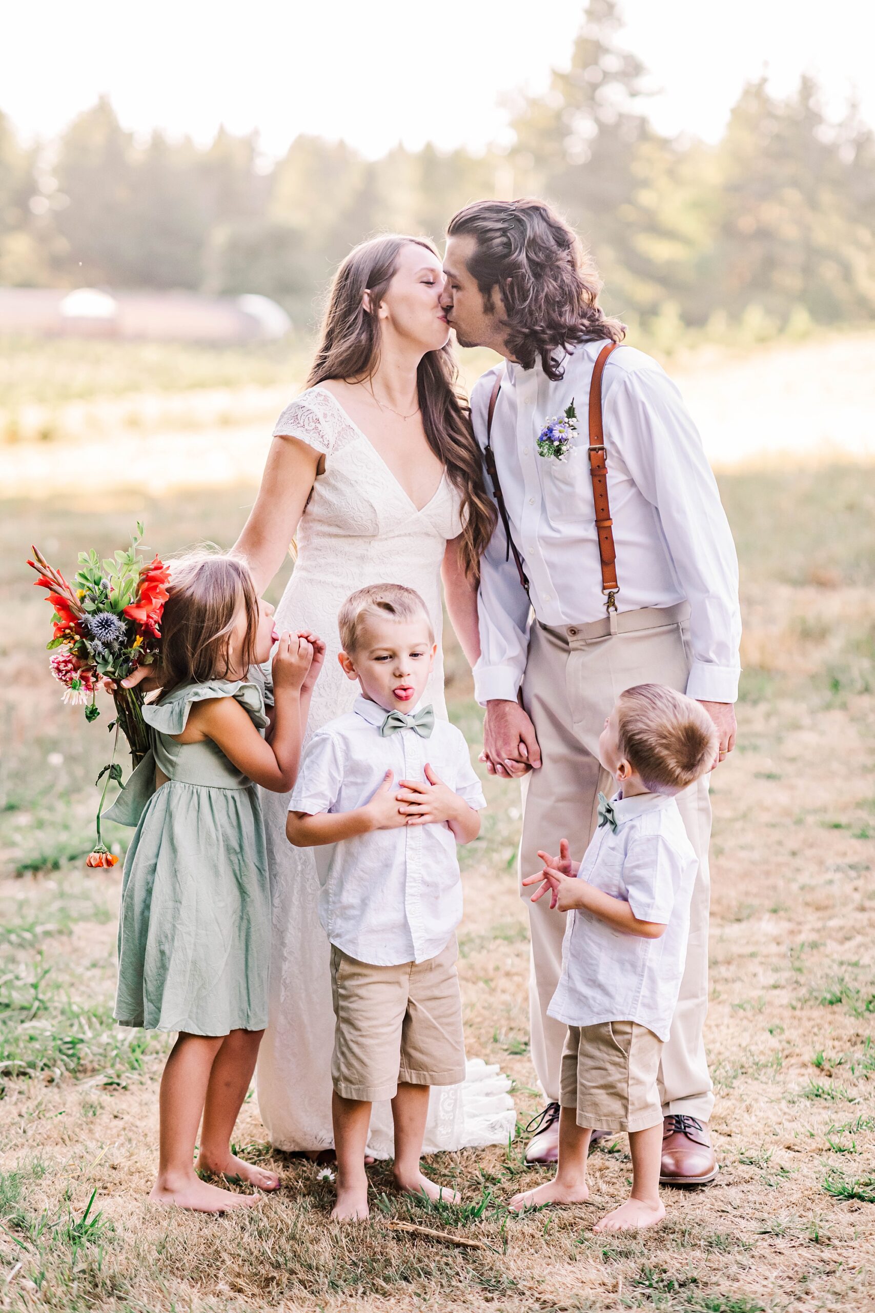 candid wedding portraits of newlyweds and kids